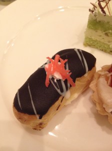 Chocolate eclair topped with pink seaweed
